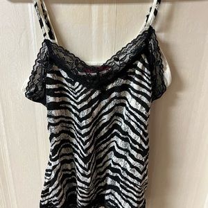 Black and white zebra print tank top with padding/bra.  Juniors LG.